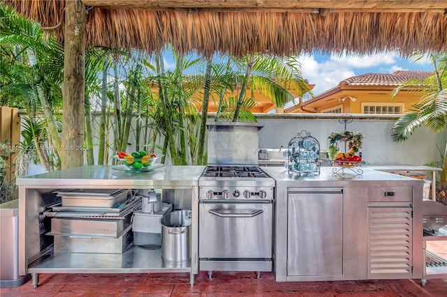 view of patio / terrace featuring exterior kitchen