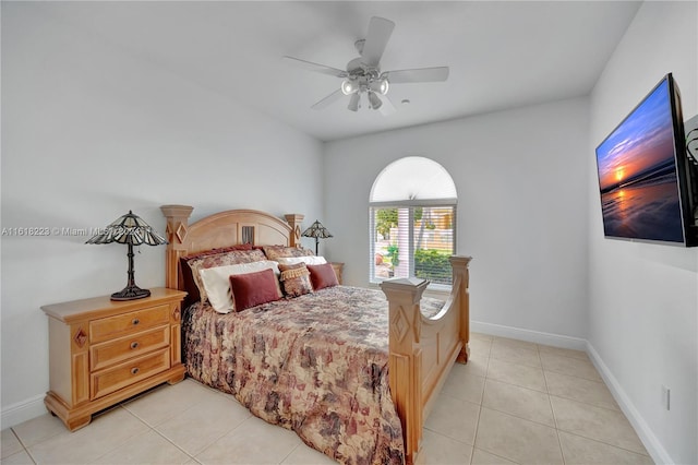 tiled bedroom featuring ceiling fan