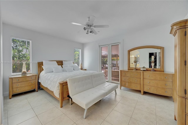 bedroom featuring light tile patterned floors, access to outside, and ceiling fan