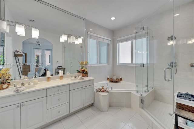 bathroom featuring tile patterned flooring, shower with separate bathtub, vanity, and ceiling fan