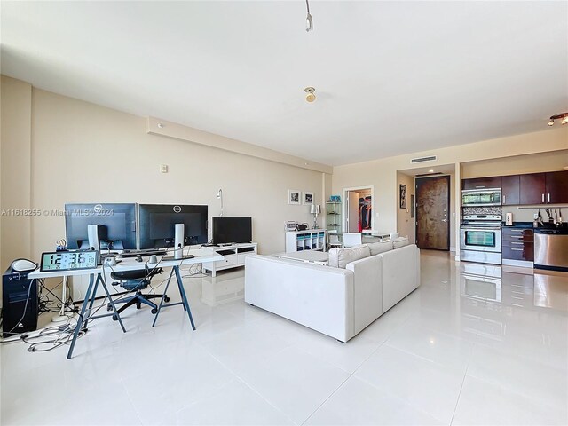 living room with light tile patterned floors