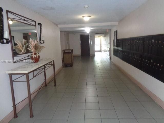 hallway featuring light tile patterned floors