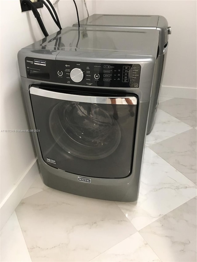 laundry room featuring washer / dryer