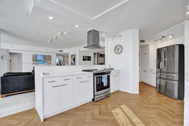 kitchen featuring island exhaust hood, kitchen peninsula, appliances with stainless steel finishes, and white cabinetry