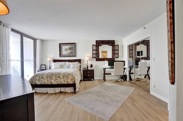 bedroom featuring light hardwood / wood-style flooring and a closet