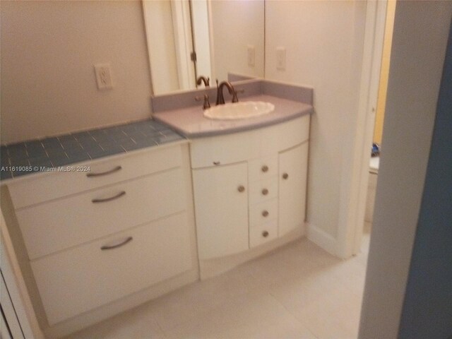 bathroom with vanity and tile patterned flooring