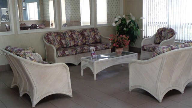 living room with tile patterned floors and a healthy amount of sunlight