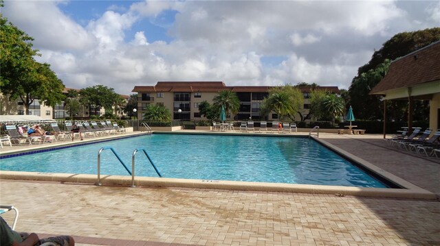 view of pool featuring a patio