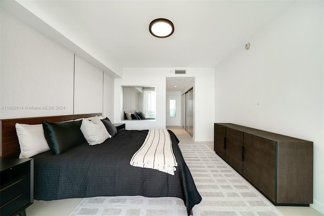 bedroom featuring visible vents