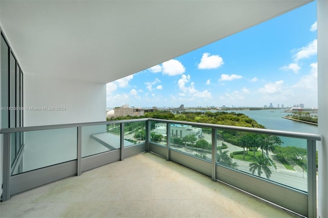 balcony with a view of city and a water view