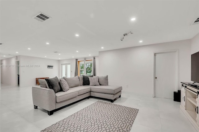 living room with light tile patterned floors