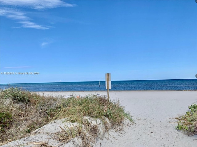 view of water feature with a beach view