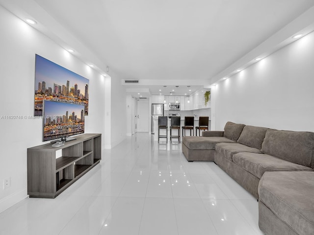 100 Bayview Dr Unit 430, Sunny Isles Beach, FL 33160 - living room featuring light tile patterned flooring and recessed lighting