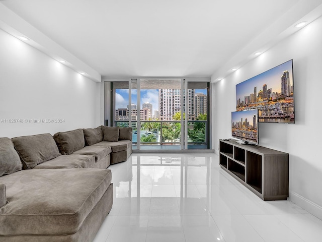 tiled living room featuring expansive windows