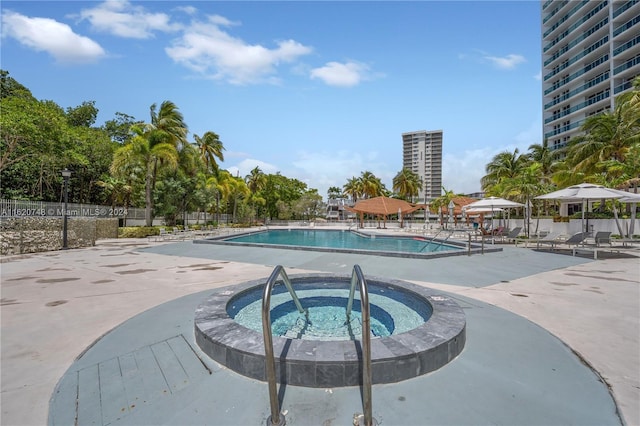100 Bayview Dr Unit 430, Sunny Isles Beach, FL 33160 - community pool featuring a community hot tub and a patio area
