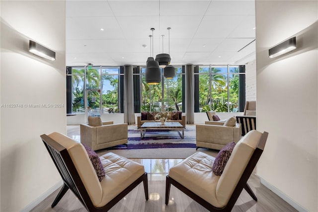 interior space featuring light wood-type flooring and floor to ceiling windows