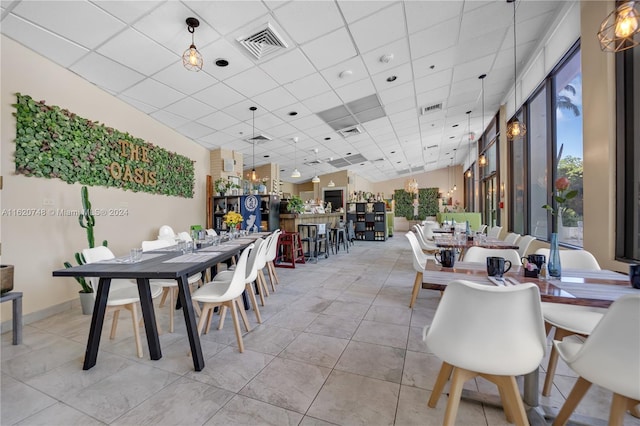100 Bayview Dr Unit 430, Sunny Isles Beach, FL 33160 - dining room with a drop ceiling and light tile patterned flooring
