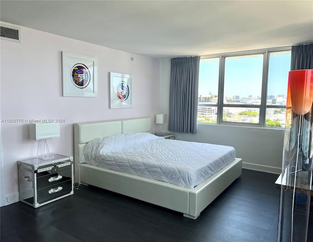 bedroom featuring dark hardwood / wood-style flooring