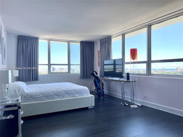 bedroom featuring dark hardwood / wood-style flooring