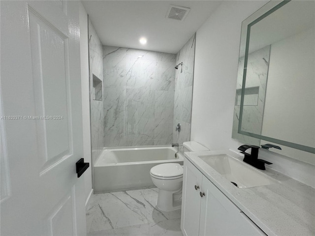 full bathroom with tiled shower / bath combo, toilet, and vanity