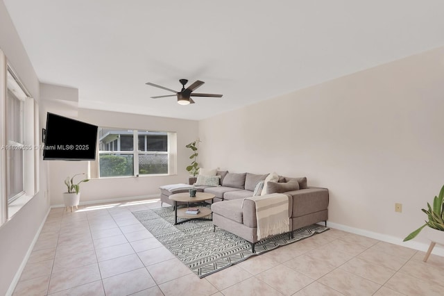 living room featuring ceiling fan and light tile patterned floors