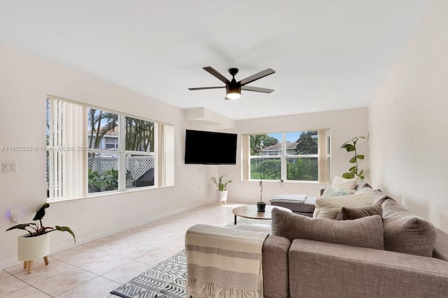 living room with ceiling fan and light tile patterned floors