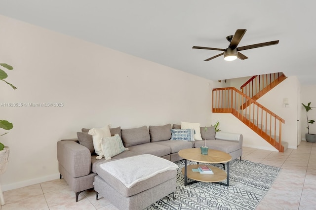 tiled living room featuring ceiling fan