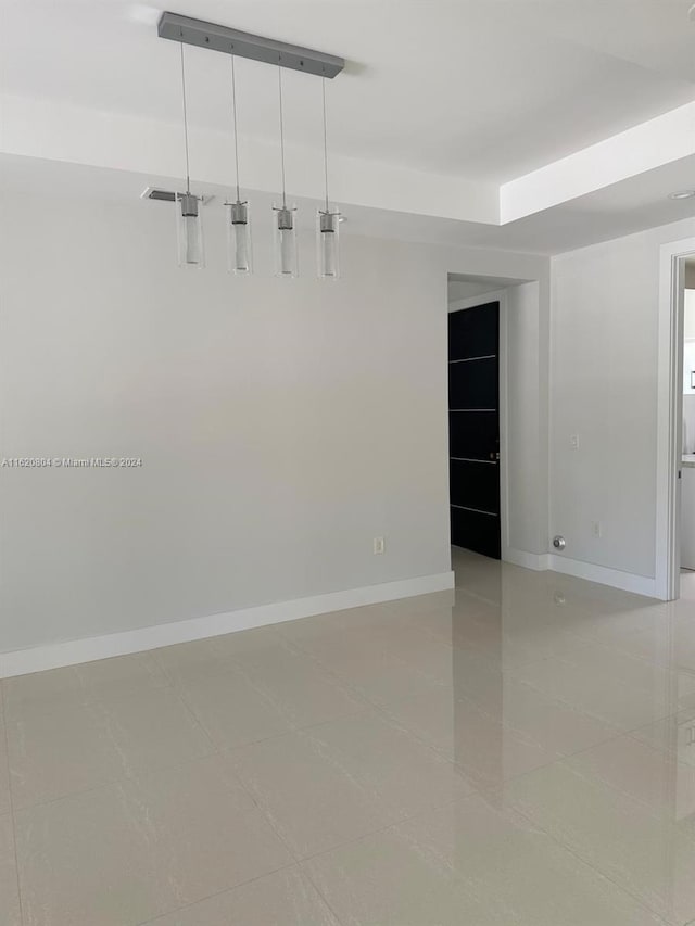 spare room featuring tile patterned flooring