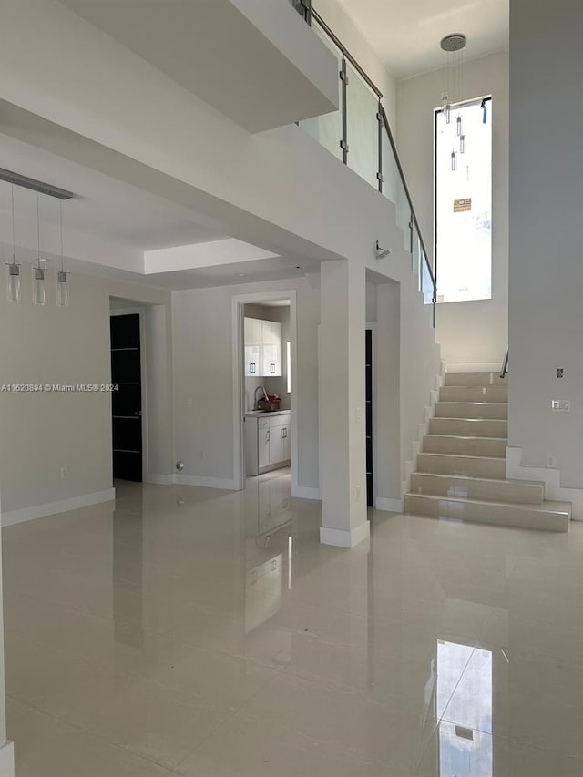 staircase featuring tile patterned flooring