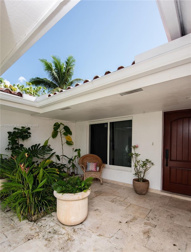 property entrance featuring a patio