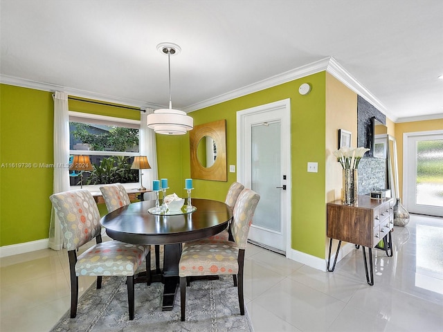 tiled dining space featuring ornamental molding