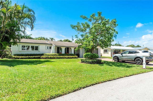 ranch-style home featuring a front yard