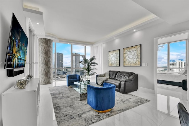 living room featuring floor to ceiling windows