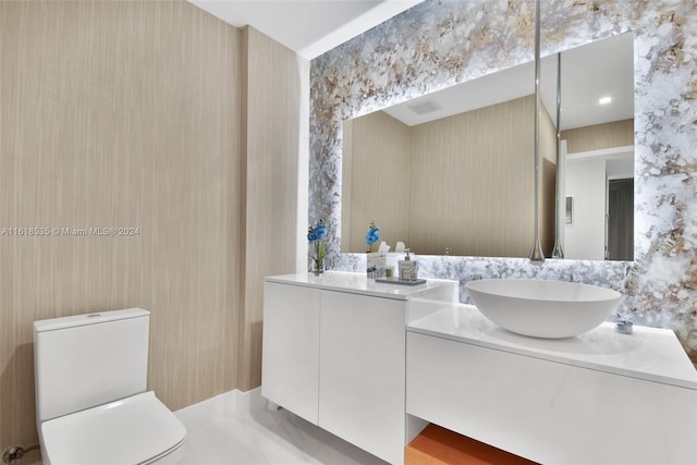 bathroom with vanity and toilet