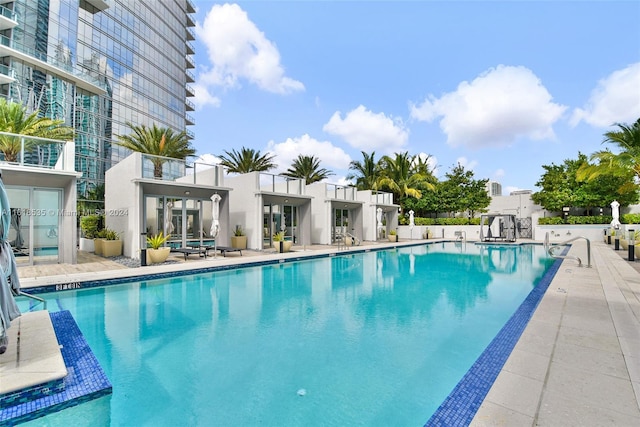 view of swimming pool with a patio area