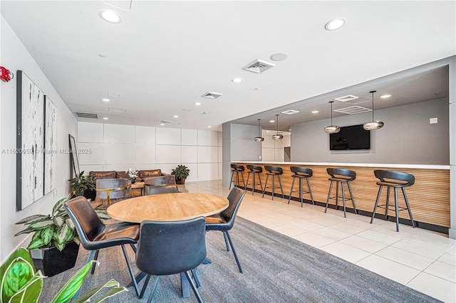 tiled dining area featuring visible vents and recessed lighting