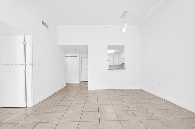 hallway featuring light tile patterned floors