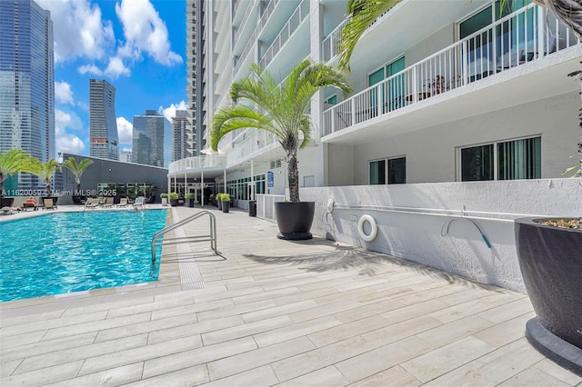 view of pool featuring a city view