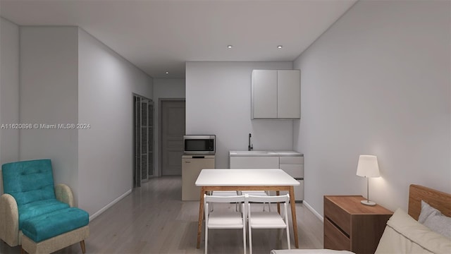 interior space with light wood-type flooring and sink