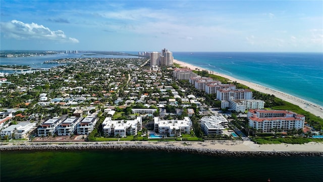 bird's eye view featuring a view of the beach and a water view