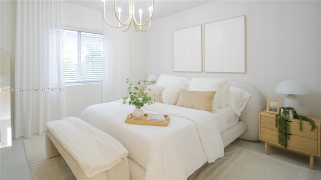 bedroom featuring an inviting chandelier and light carpet