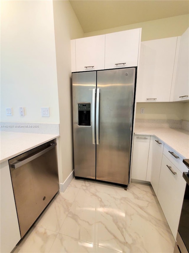 kitchen with stainless steel appliances and white cabinets