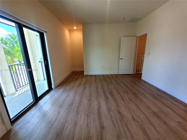 empty room featuring hardwood / wood-style floors