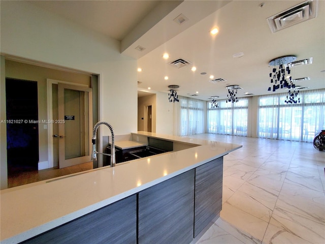 4278 NW 82nd Ave Unit 4278, Doral, FL 33166 - kitchen with light marble finish floors, open floor plan, recessed lighting, light countertops, and a sink