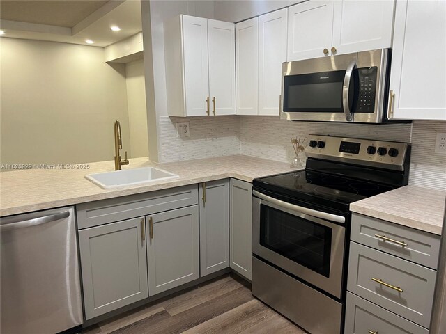 unfurnished room with hardwood / wood-style floors and a textured ceiling