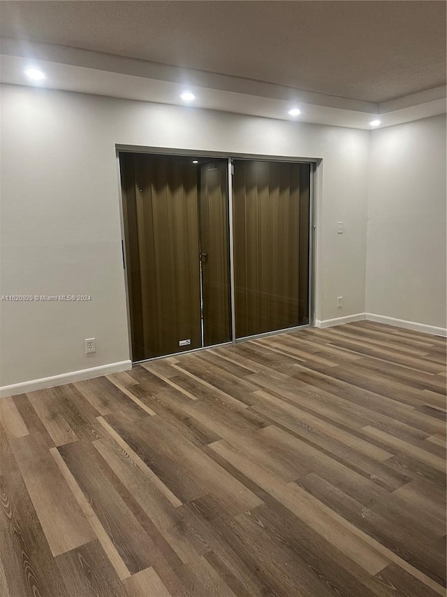 unfurnished room featuring hardwood / wood-style floors