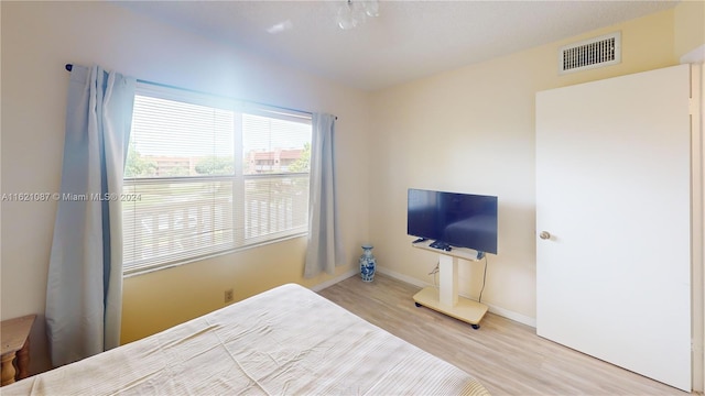 bedroom featuring hardwood / wood-style floors