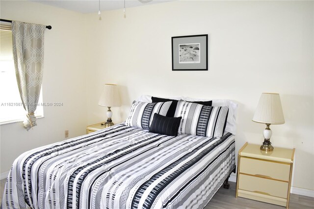 bedroom with hardwood / wood-style flooring