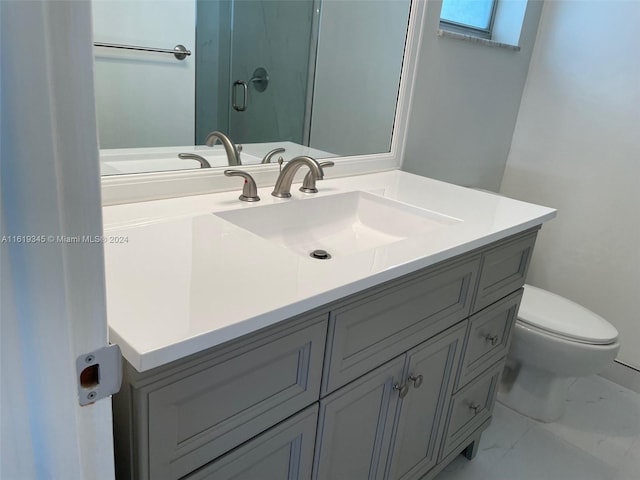 bathroom featuring toilet, a skylight, tile patterned flooring, and vanity