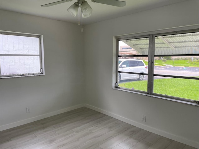 unfurnished room featuring light wood-type flooring and ceiling fan